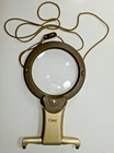 Dritz Hands-free Magnifier (2.5X 4X) W/leds, Adjustable Strap, Fold-out Stand Used. Price: $17.65.