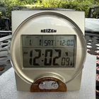 Reizen Talking Atomic Alarm Clock Calendar Gold W/ Wood Accents Battery Operated Used. Price: $26.99.