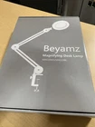Beyamz Magnifying Desk Lamp. MAG19WH/NAG19BL New. Price: $50.00.