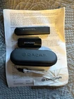 Orcam - Portable Text Reader Assistive Technology Plus Charger Power Bank Used. Price: $700.00.